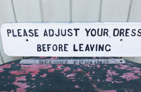 A Cast Iron Victorian Sign "Please Adjust Your Dress" Before Leaving"