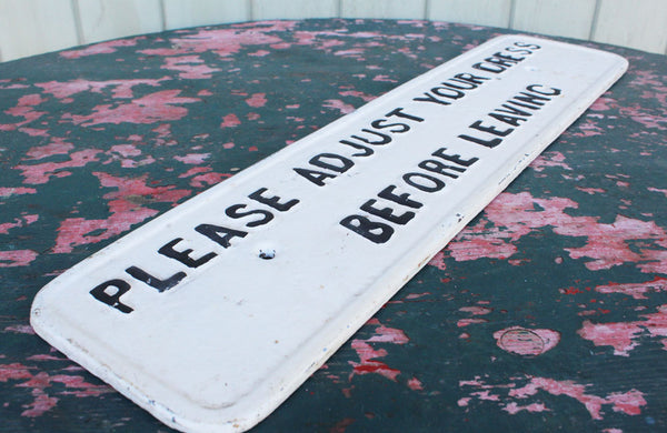 A Cast Iron Victorian Sign "Please Adjust Your Dress" Before Leaving"