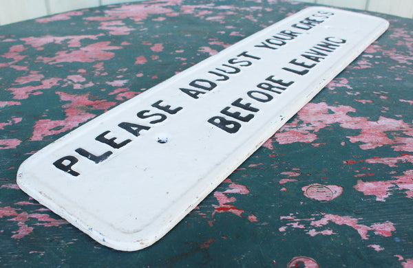 A Cast Iron Victorian Sign "Please Adjust Your Dress" Before Leaving"