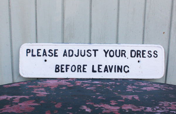 A Cast Iron Victorian Sign "Please Adjust Your Dress" Before Leaving"