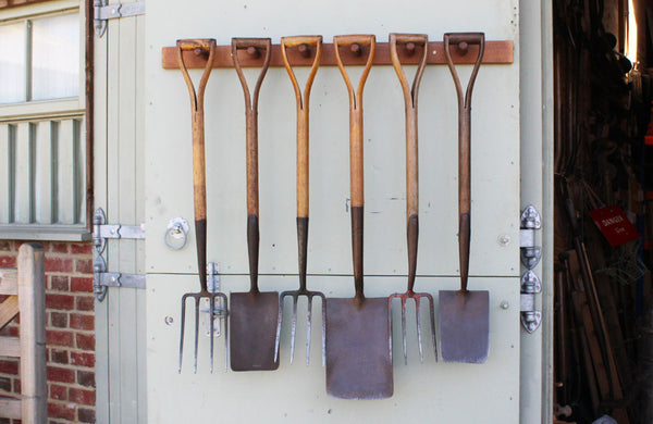 A Rack of 6 Vintage Spades and Forks