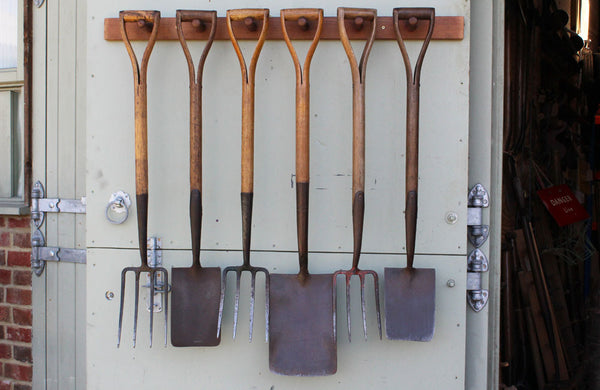 A Rack of 6 Vintage Spades and Forks