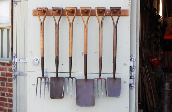 A Rack of 6 Vintage Spades and Forks