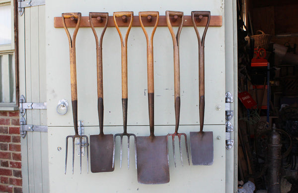 A Rack of 6 Vintage Spades and Forks