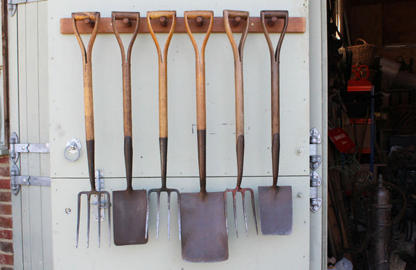 A Rack of 6 Vintage Spades and Forks