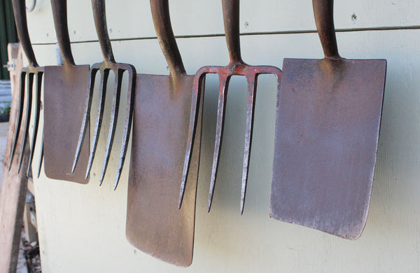 A Rack of 6 Vintage Spades and Forks