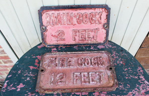A Victorian Cast Iron Sign "Fire Cock 12 Feet"