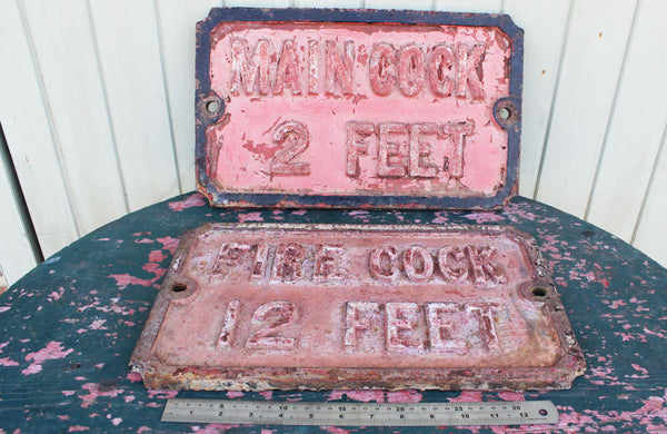 A Victorian Cast Iron Sign "Fire Cock 12 Feet"