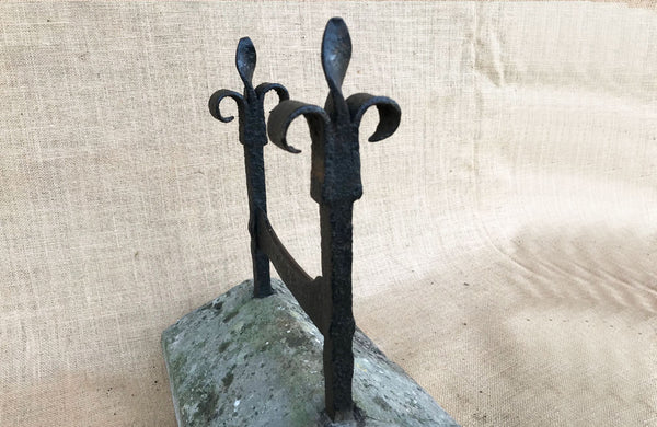 A Victorian Wrought Iron boot Scraper with Fleur de Lys Scrolls