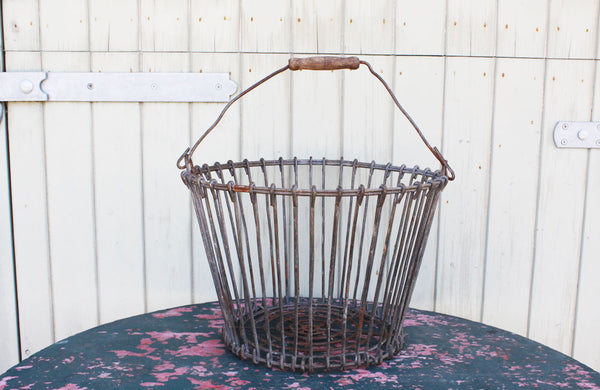 A Vintage Potato Basket with Wooden Handel
