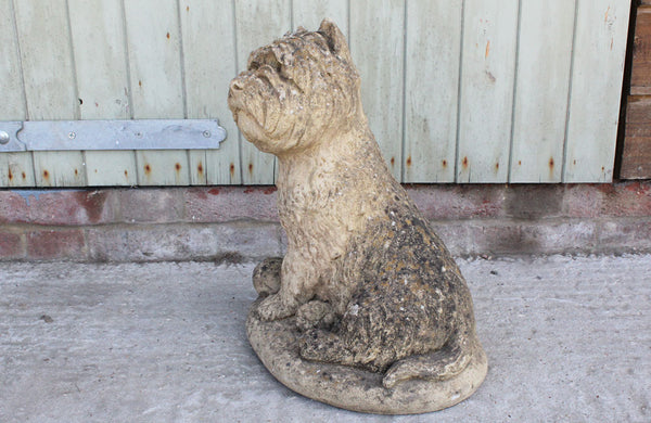A Reconstituted Stone Figure of a West Highland Terrier Dog