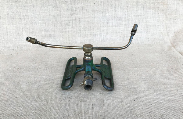 A Dronwal Iron and Brass Lawn Sprinkler