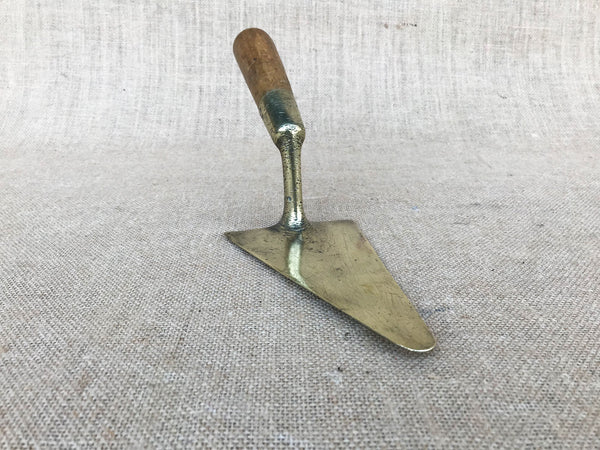 A French brass trowel