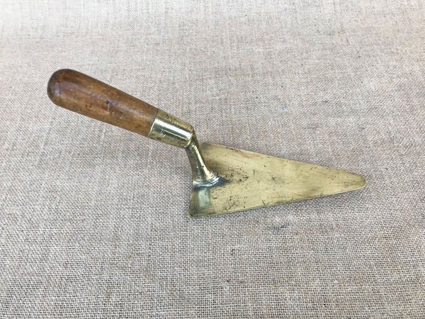A French brass trowel