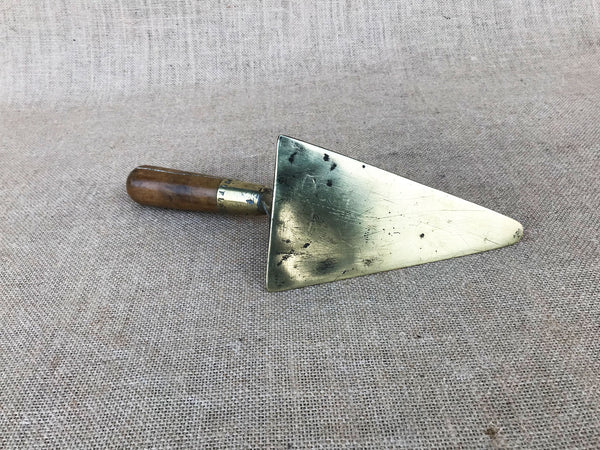 A French brass trowel