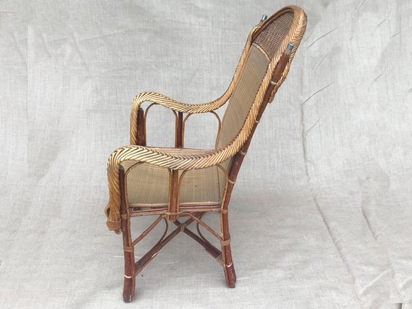 An early 20th century rattan armchair