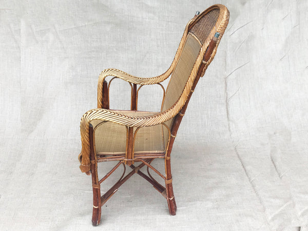 An early 20th century rattan armchair