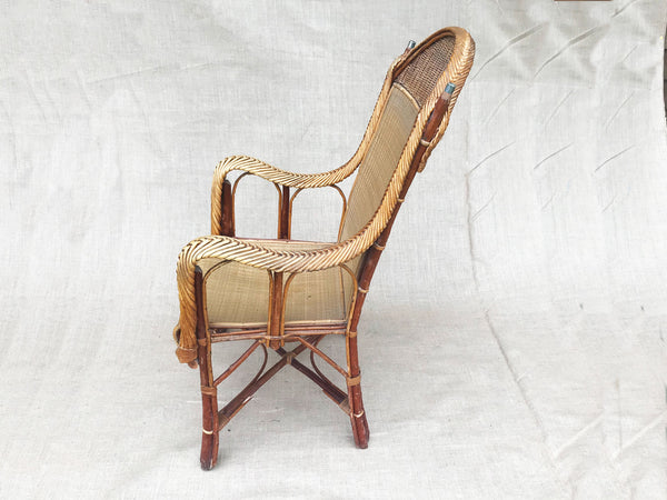 An early 20th century rattan armchair
