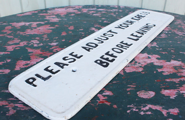A Cast Iron Victorian Sign "Please Adjust Your Dress" Before Leaving" 