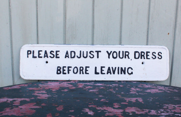 A Cast Iron Victorian Sign "Please Adjust Your Dress" Before Leaving" 