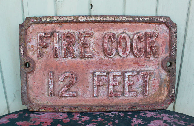 A Victorian Cast Iron Sign "Fire Cock 12 Feet"