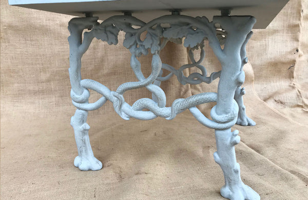 A Bench made from Antique Bench Ends Cast with Trees, Serpents & Acorns
