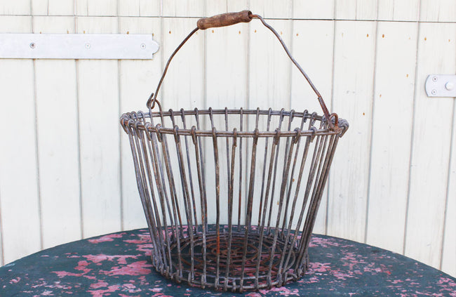 A Vintage Potato Basket with Wooden Handel