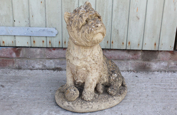A Reconstituted Stone Figure of a West Highland Terrier Dog