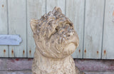 A Reconstituted Stone Figure of a West Highland Terrier Dog