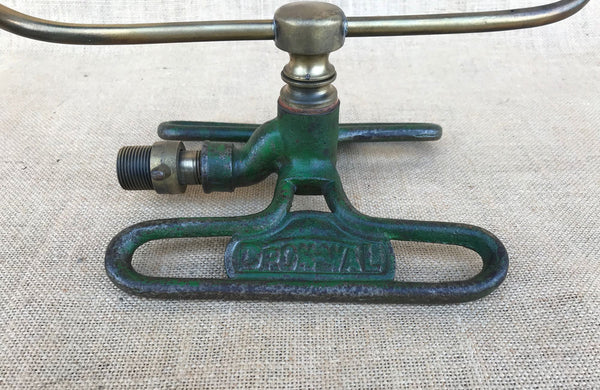 A Dronwal Iron and Brass Lawn Sprinkler
