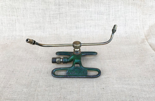 A Dronwal Iron and Brass Lawn Sprinkler